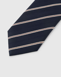 Navy paisley droplet detail on chestnut mulberry silk tie showing hand-embroidered interior detailing by STICKYZOO
