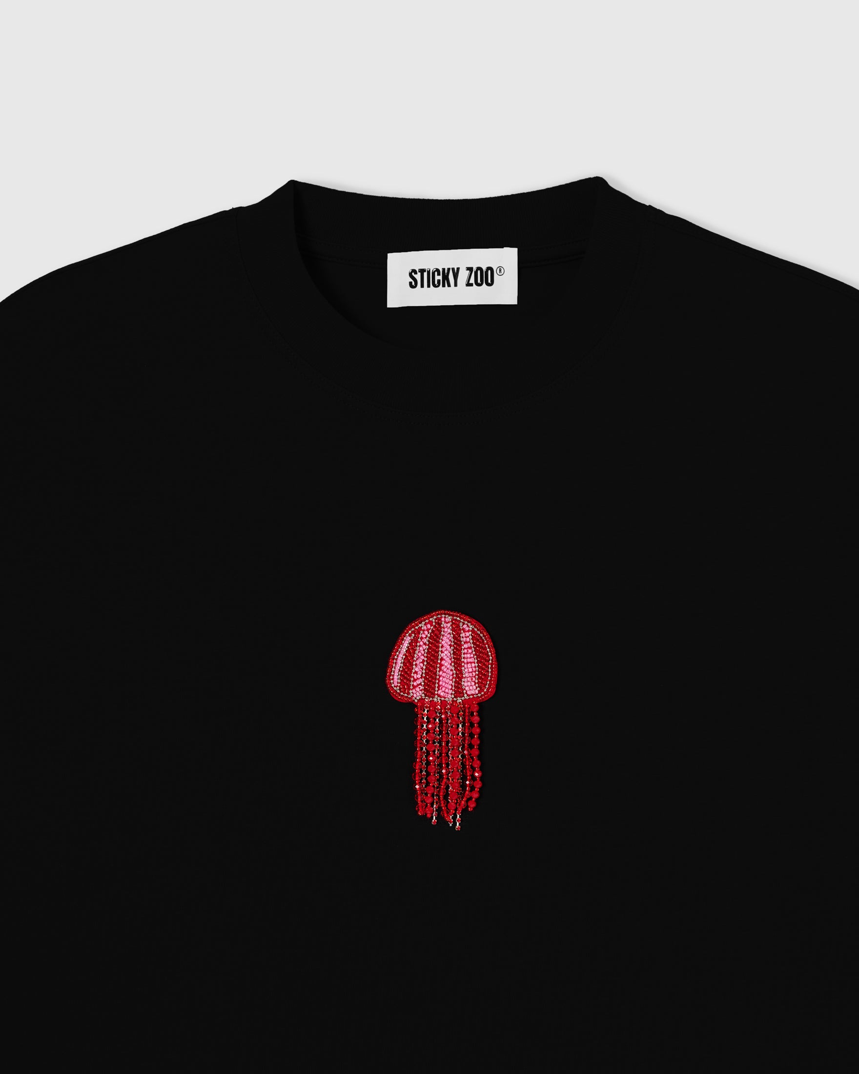 Hand-beaded jellyfish appliqué on cool-touch cotton with a pink and red striped sequin bell and dangling faceted glass-bead tentacles