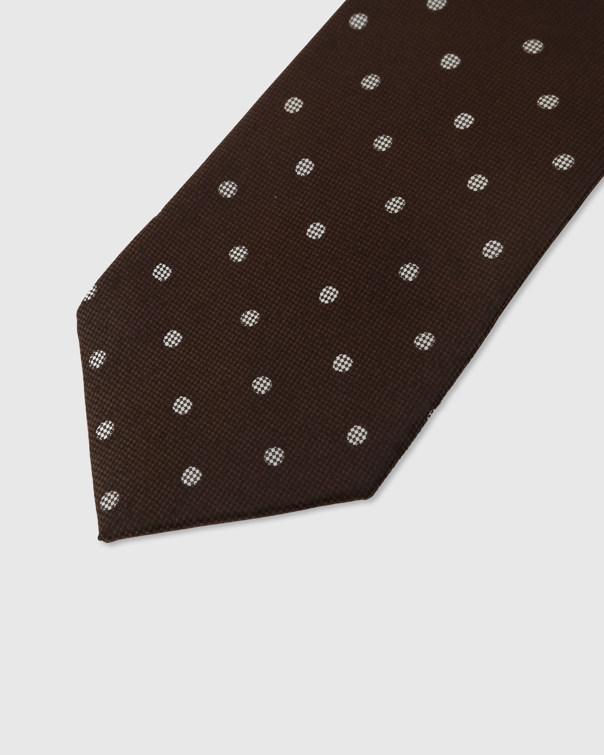 Silver polka dot detail on walnut mulberry silk tie showing raised hand-embroidered thread with micro-checkerboard by STICKYZOO