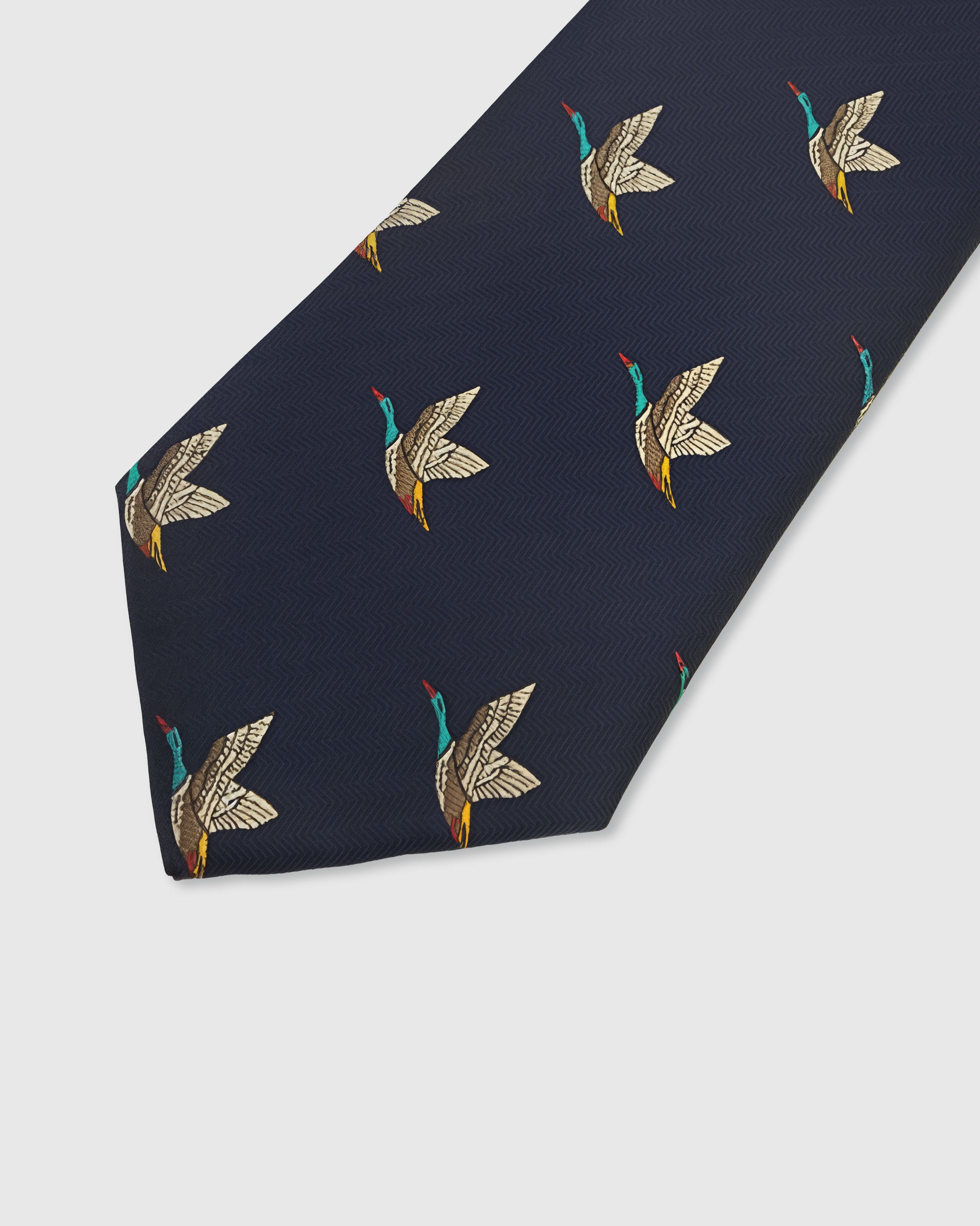 {Embroidered mallard duck motif detail} Mallard duck detail on midnight navy mulberry silk tie showing embroidered pattern by STICKYZOO