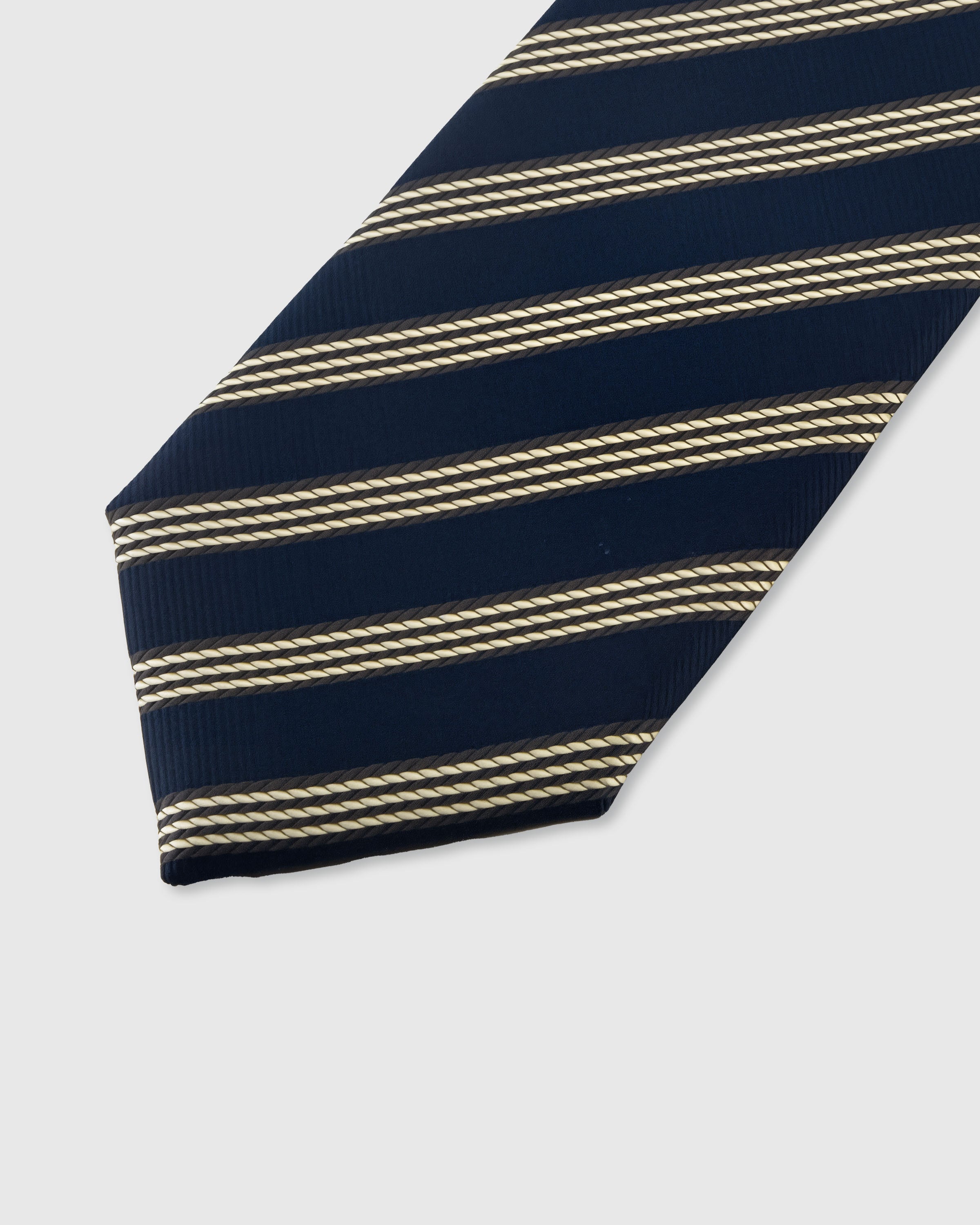 STICKYZOO NAVY TRIPLE STRIPE TIE — hand-embroidered detail showing gold triple-line diagonal stripes, stitched not printed