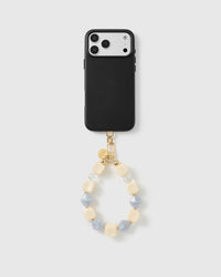 Handmade beaded phone strap on a black case, rated 4.9 across 5,000+ reviews