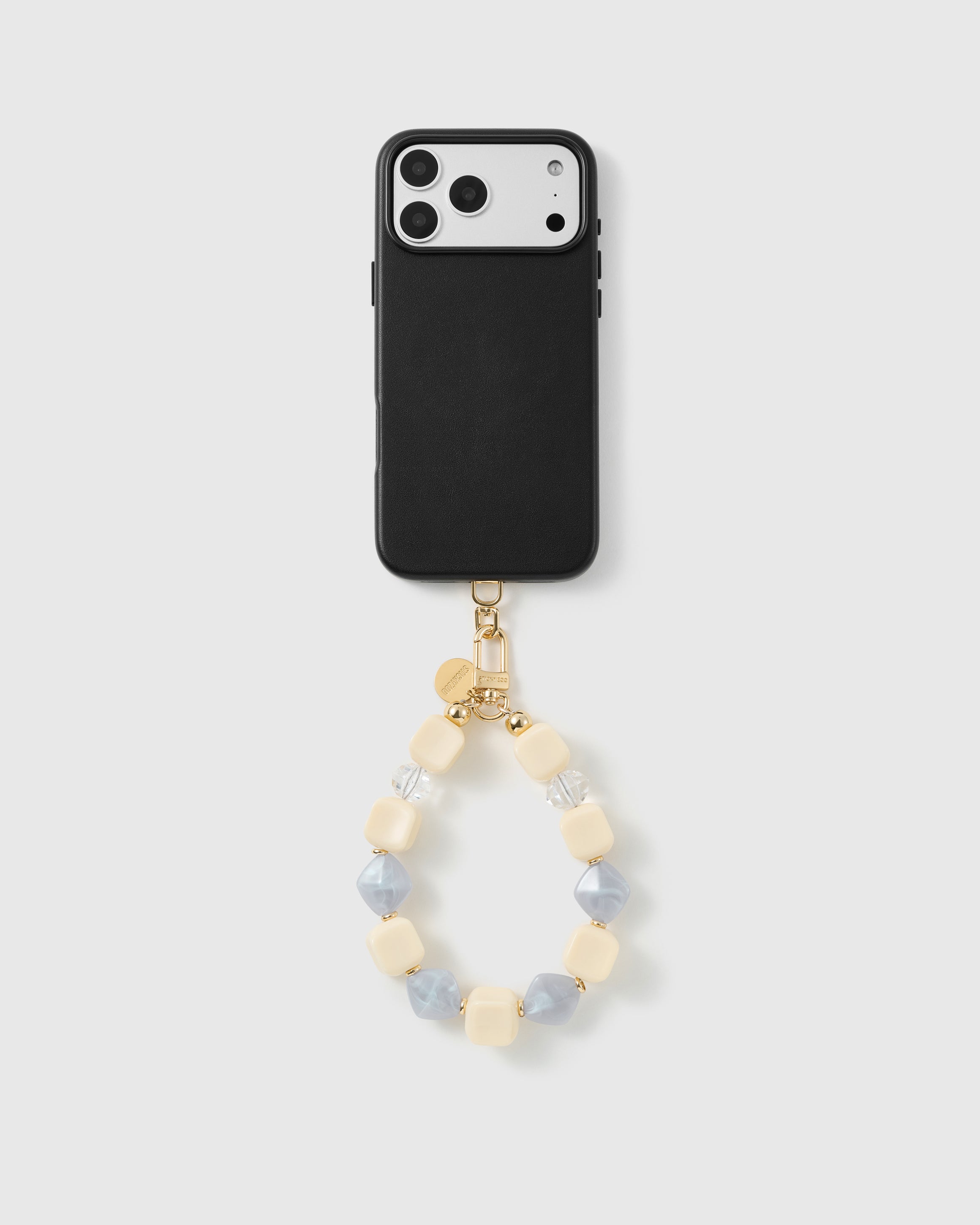 Handmade beaded phone strap on a black case, rated 4.9 across 5,000+ reviews