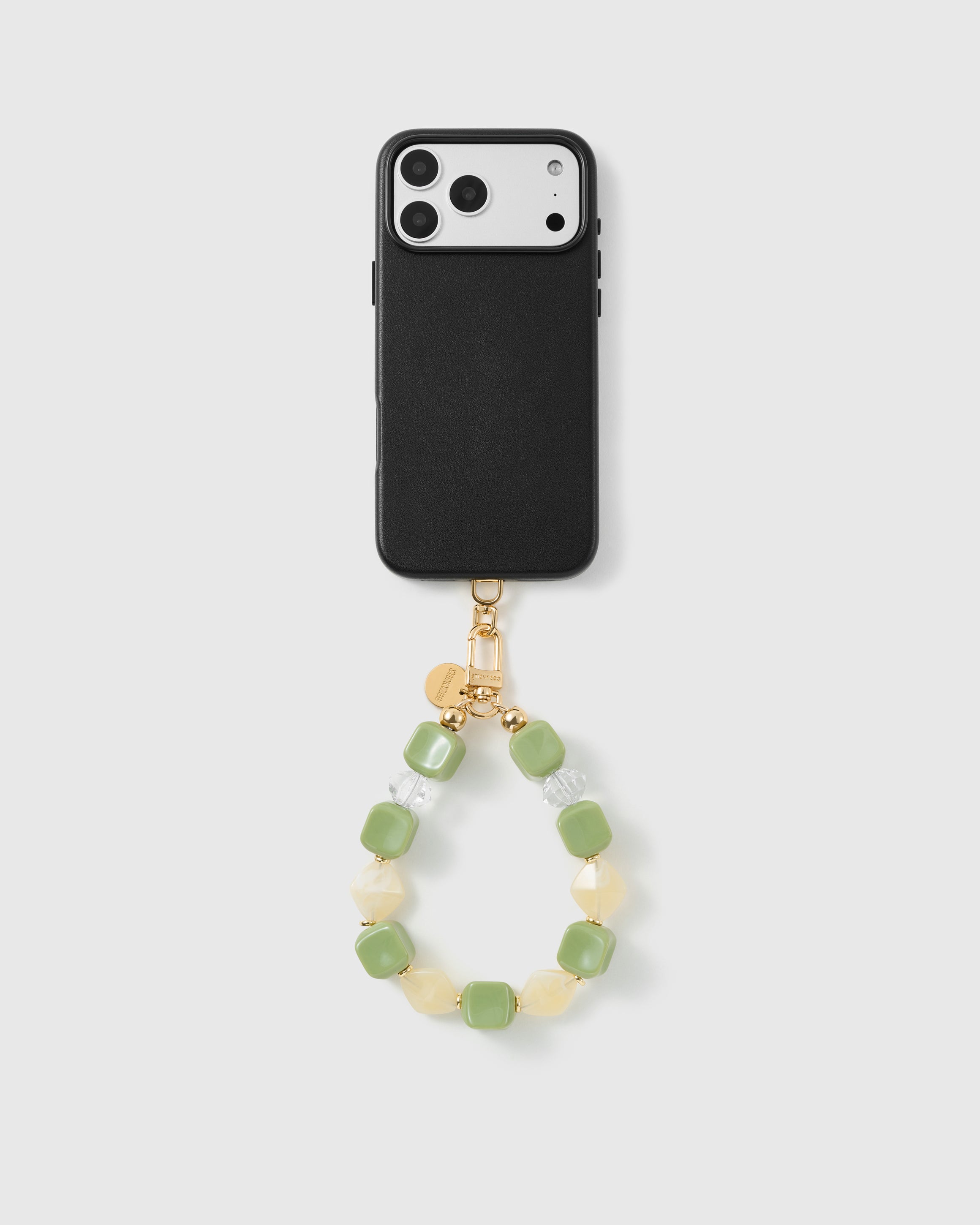 Handmade beaded phone strap on a black case, rated 4.9 across 5,000+ reviews