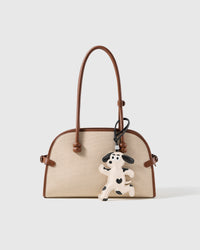 STICKYZOO leather dalmatian charm clipped to a handbag, a breed detail people recognize