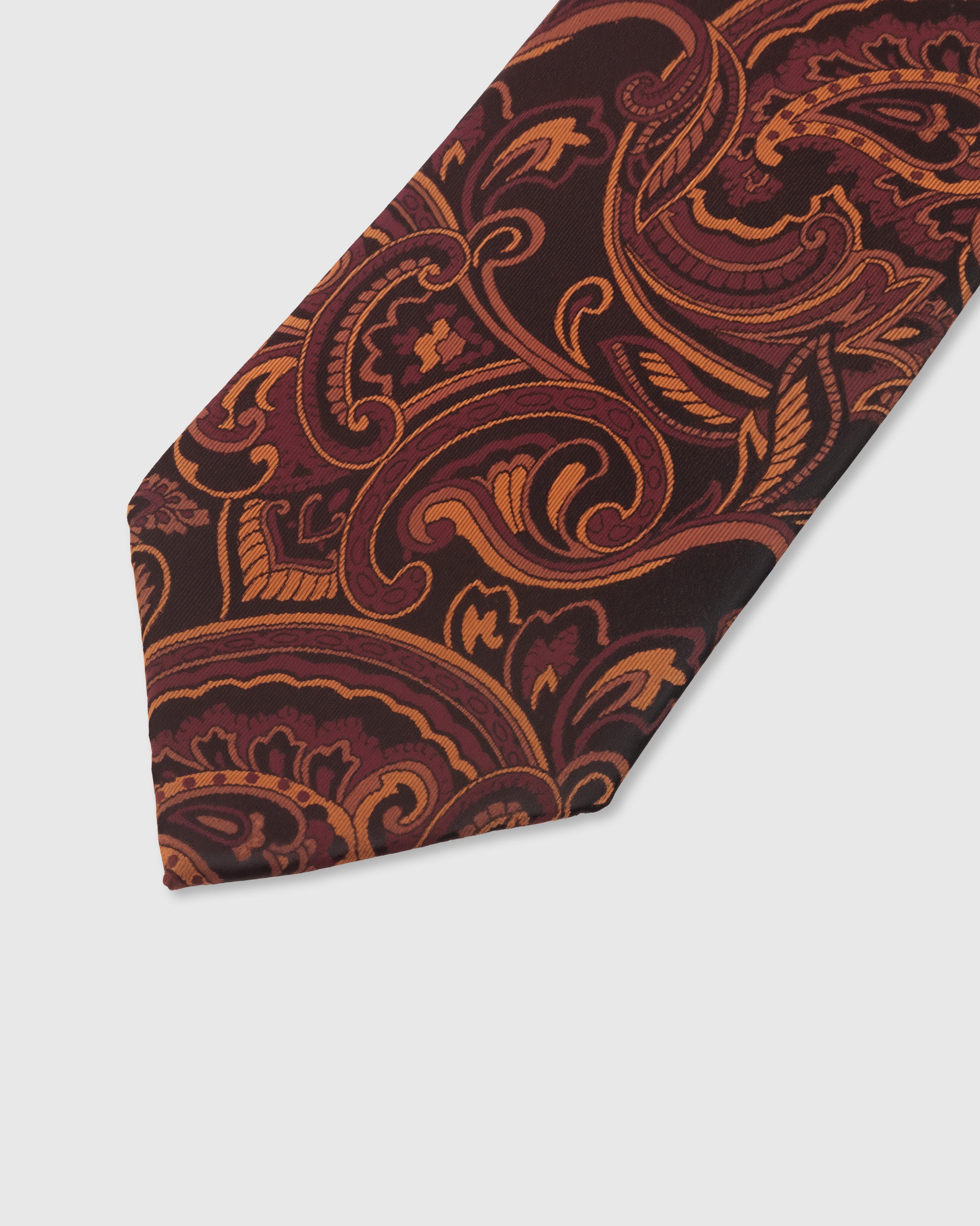 BURGUNDY PAISLEY TIE — 45° Italian bias-cut construction with structured interlining, hand-finished slip stitching visible on interior