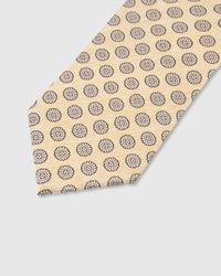 Walnut medallion circle detail on champagne mulberry silk tie showing raised hand-embroidered motif by STICKYZOO