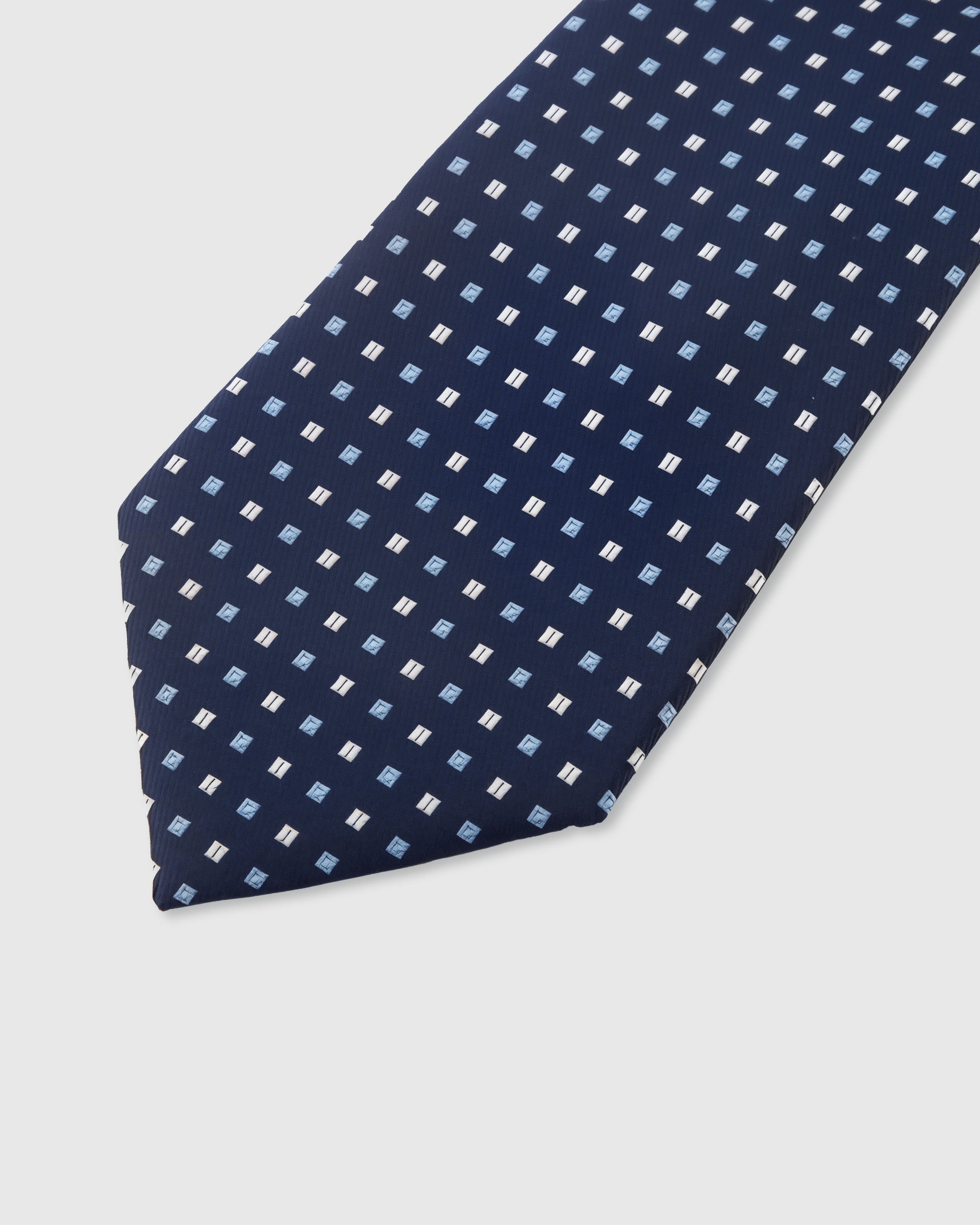 STICKYZOO Navy Mosaic Tie — detail of hand-embroidered grid dot mosaic on pure mulberry silk