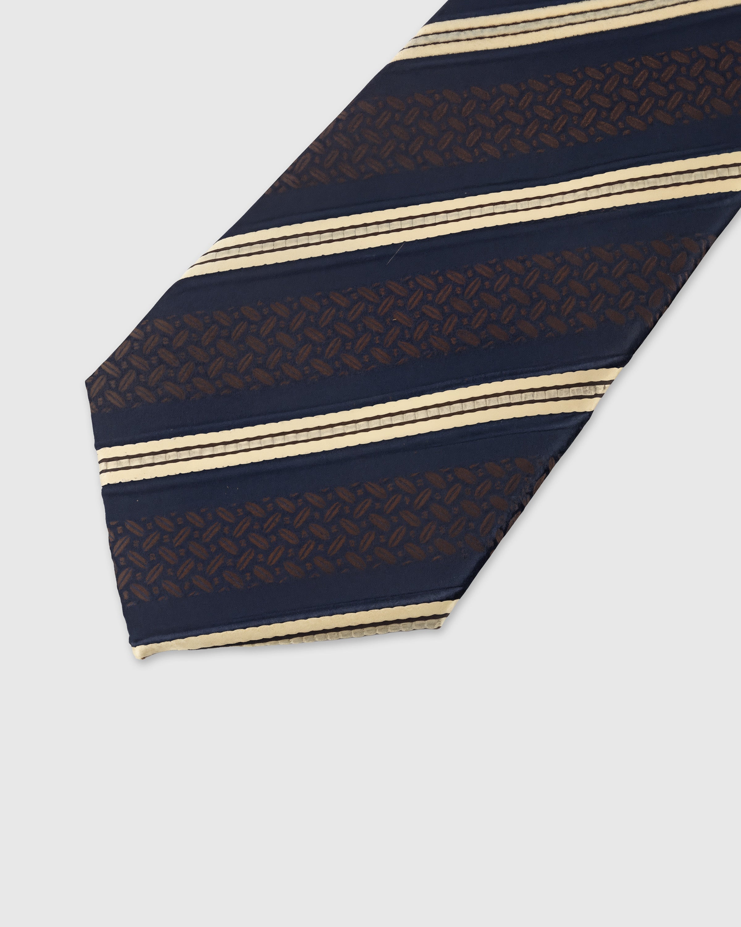Bronze brocade stripe detail on navy mulberry silk tie showing raised textured hand-embroidered weave by STICKYZOO