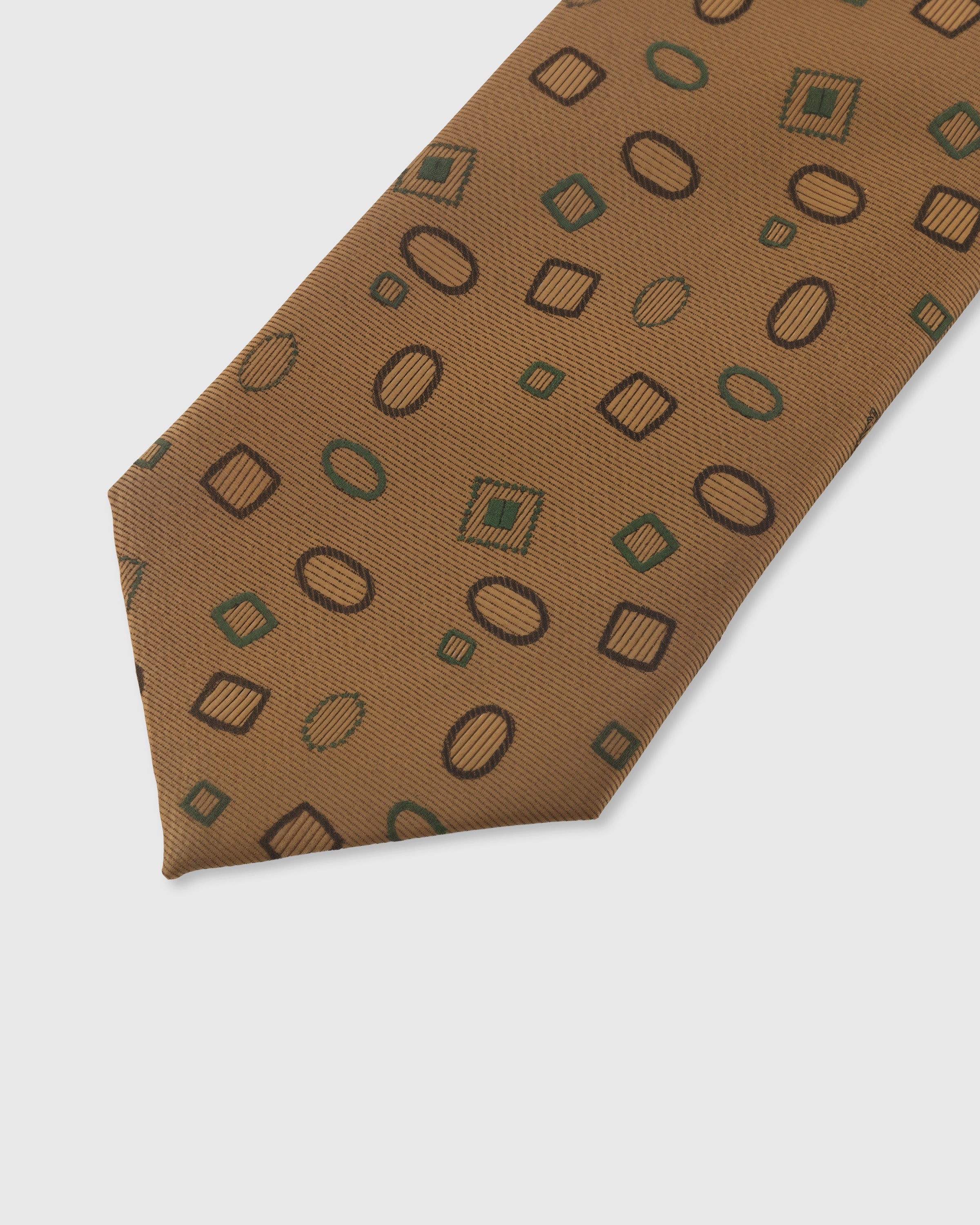 Geometric scatter detail on caramel mulberry silk tie showing hand-embroidered circles and squares by STICKYZOO
