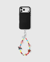 Full phone with colorful charm wrist strap attached on light grey background