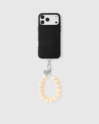 Full phone with cream heart bead strap attached showing universal compatibility