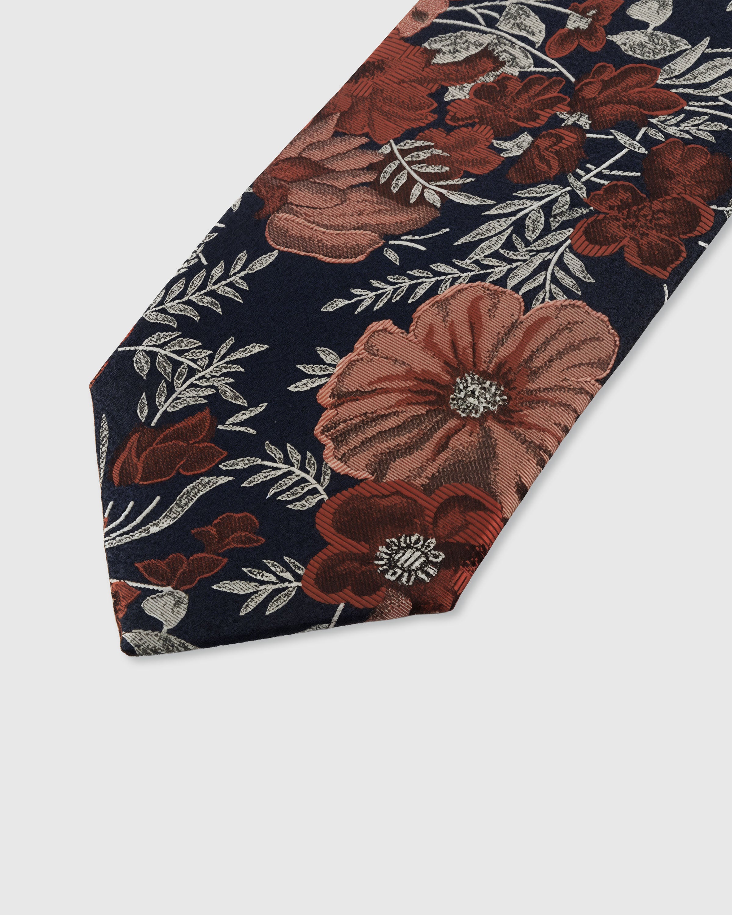 STICKYZOO MIDNIGHT PEONY TIE — hand-embroidered detail showing copper and terracotta peony blooms with silver foliage, stitched not printed