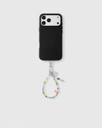 Full phone with colorful beaded strap attached showing universal compatibility