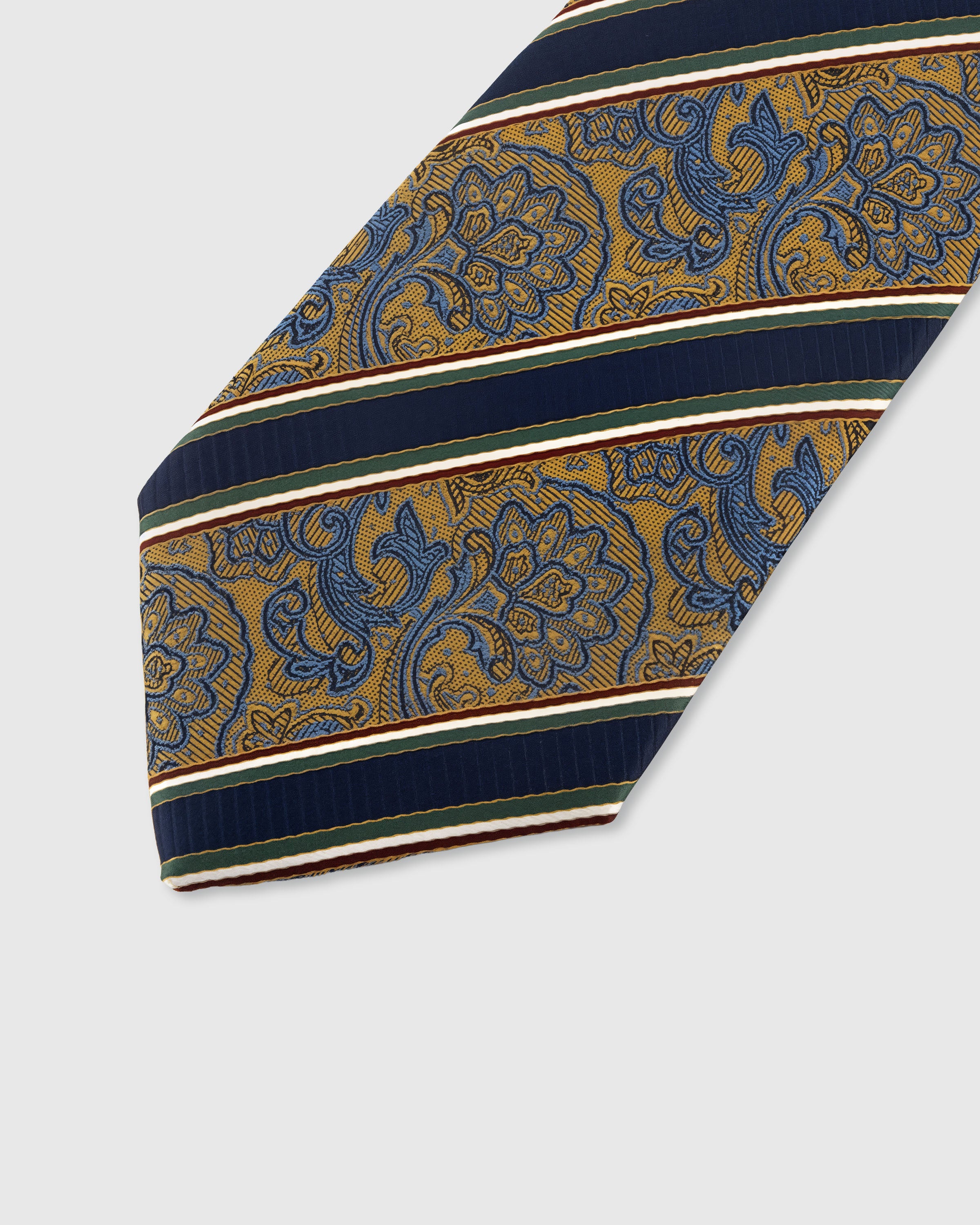 STICKYZOO NAVY PAISLEY STRIPE TIE — hand-embroidered detail showing paisley floral panels divided by navy and green stripes, stitched not printed