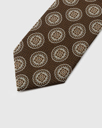 Cream medallion detail on walnut mulberry silk tie showing concentric embroidered rings by STICKYZOO