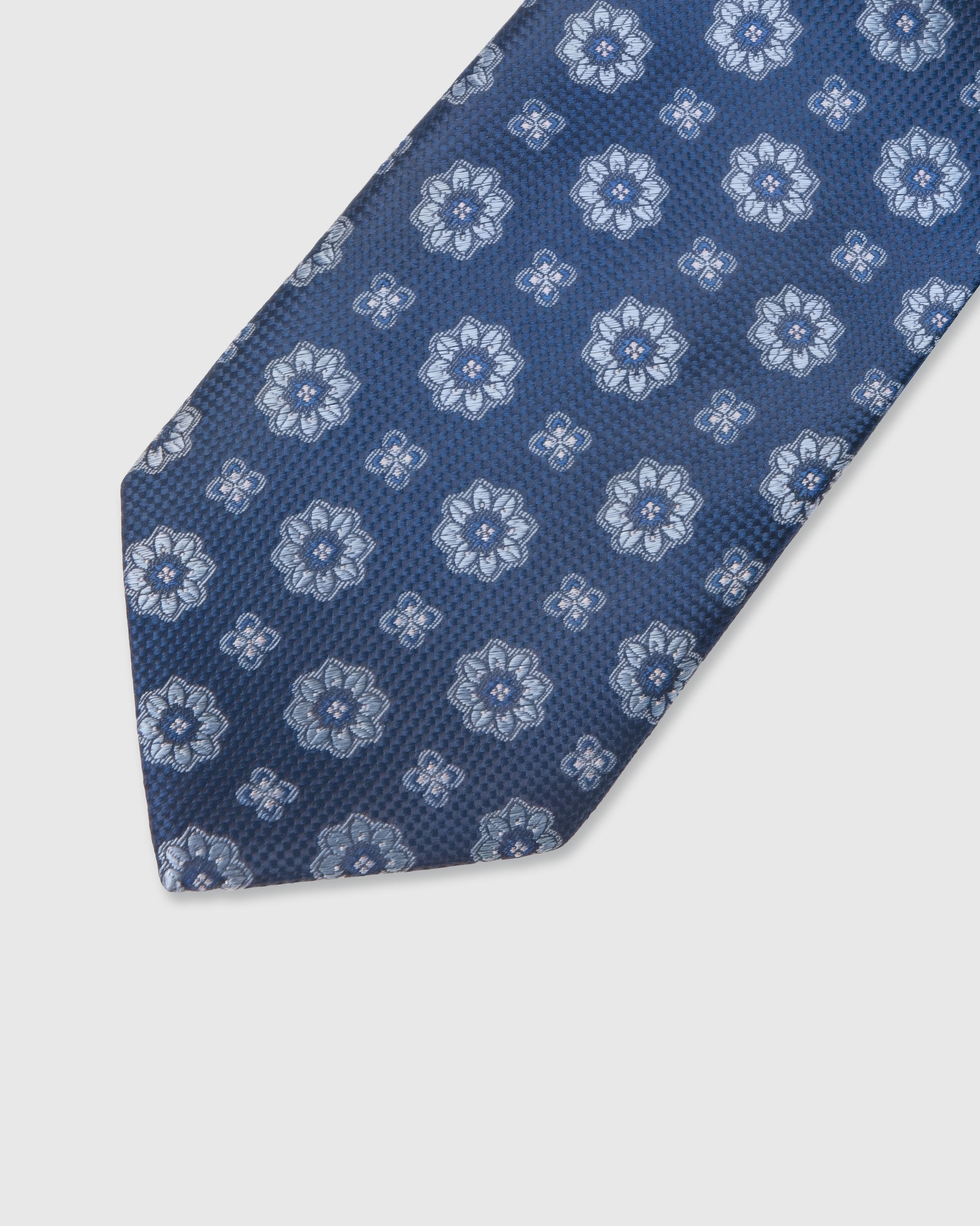 STICKYZOO Steel Blue Floral Tie — detail of hand-embroidered repeat floral on pure mulberry silk