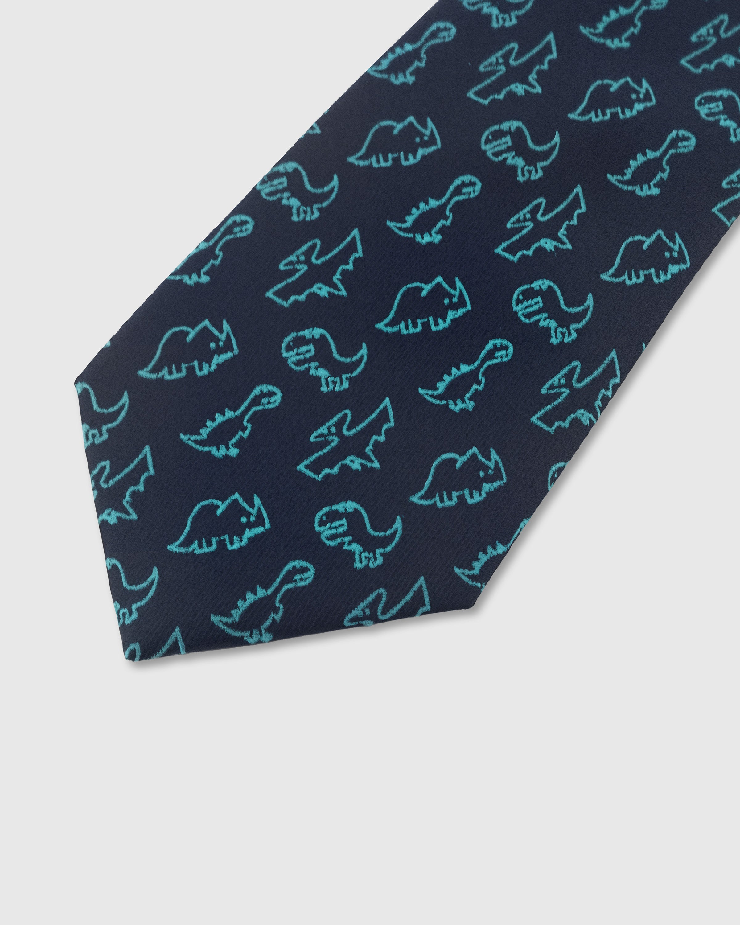 Teal dinosaur outline detail on midnight mulberry silk tie showing raised hand-embroidered motif by STICKYZOO