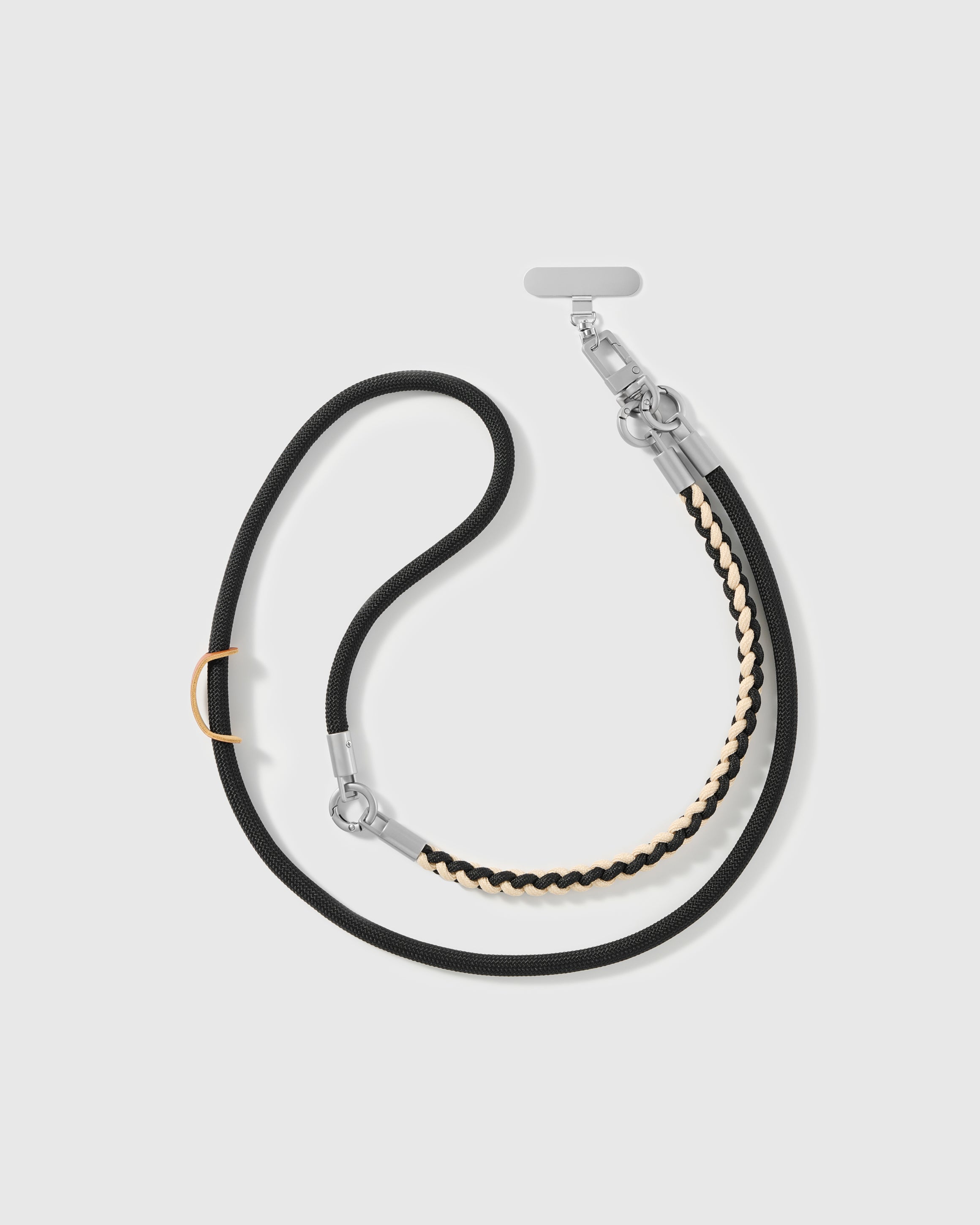 STICKYZOO adjustable cross-body phone strap in black cord with a cream braided accent and silver-tone hardware