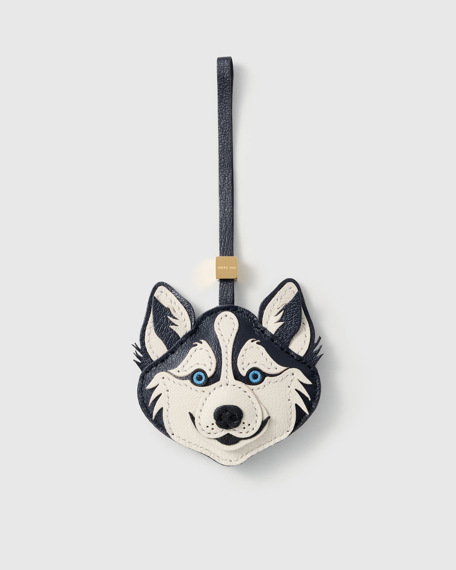 {{French Alran leather husky}} Handmade husky face charm in deep navy and cream French Alran goatskin with hand-embroidered ice-blue eyes by STICKYZOO