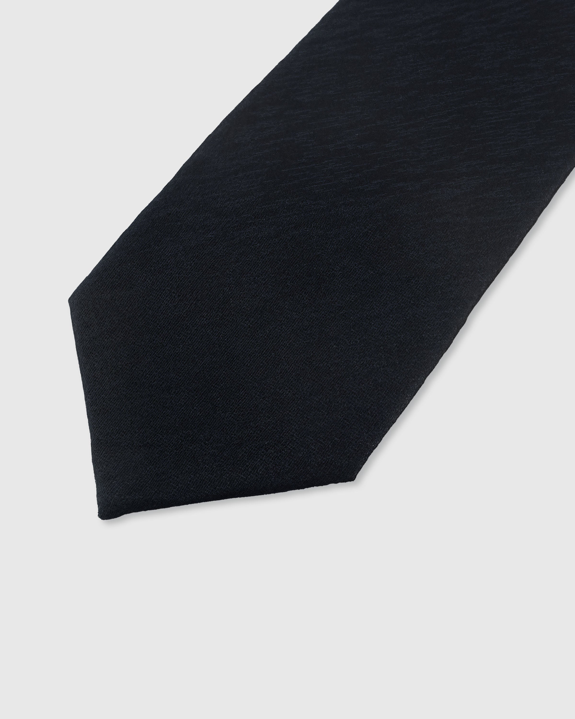 {Natural slub weave detail} Solid detail on midnight navy mulberry silk tie showing embroidered pattern by STICKYZOO