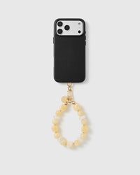 Handmade beaded phone strap on a black case, rated 4.9 across 5,000+ reviews