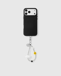 Full phone with silver cloud and smiley bead strap attached on grey background