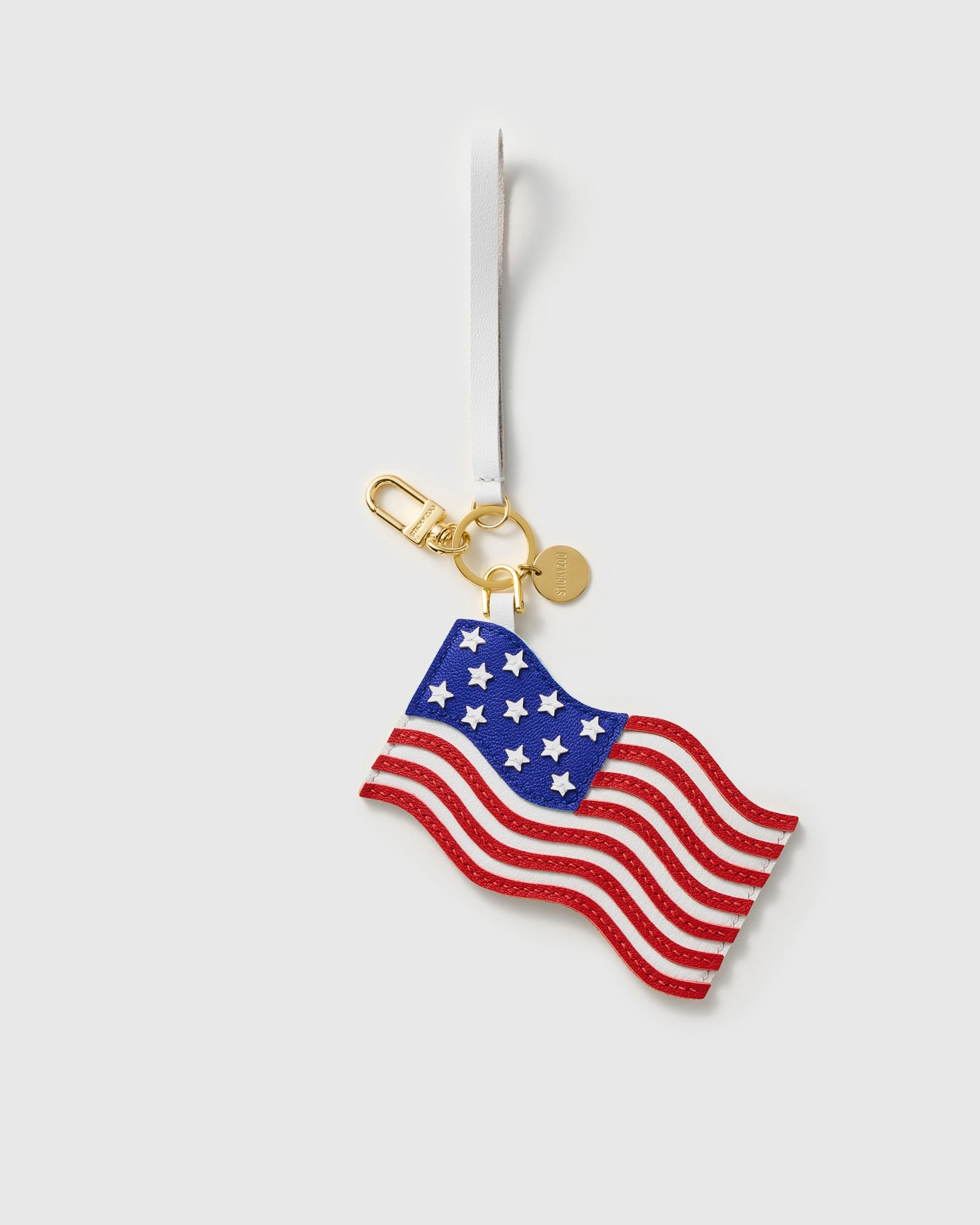 {{Dual attachment included}} Both USA flag charm styles — leather strap loop and 18K gold-plated keychain clip by STICKYZOO