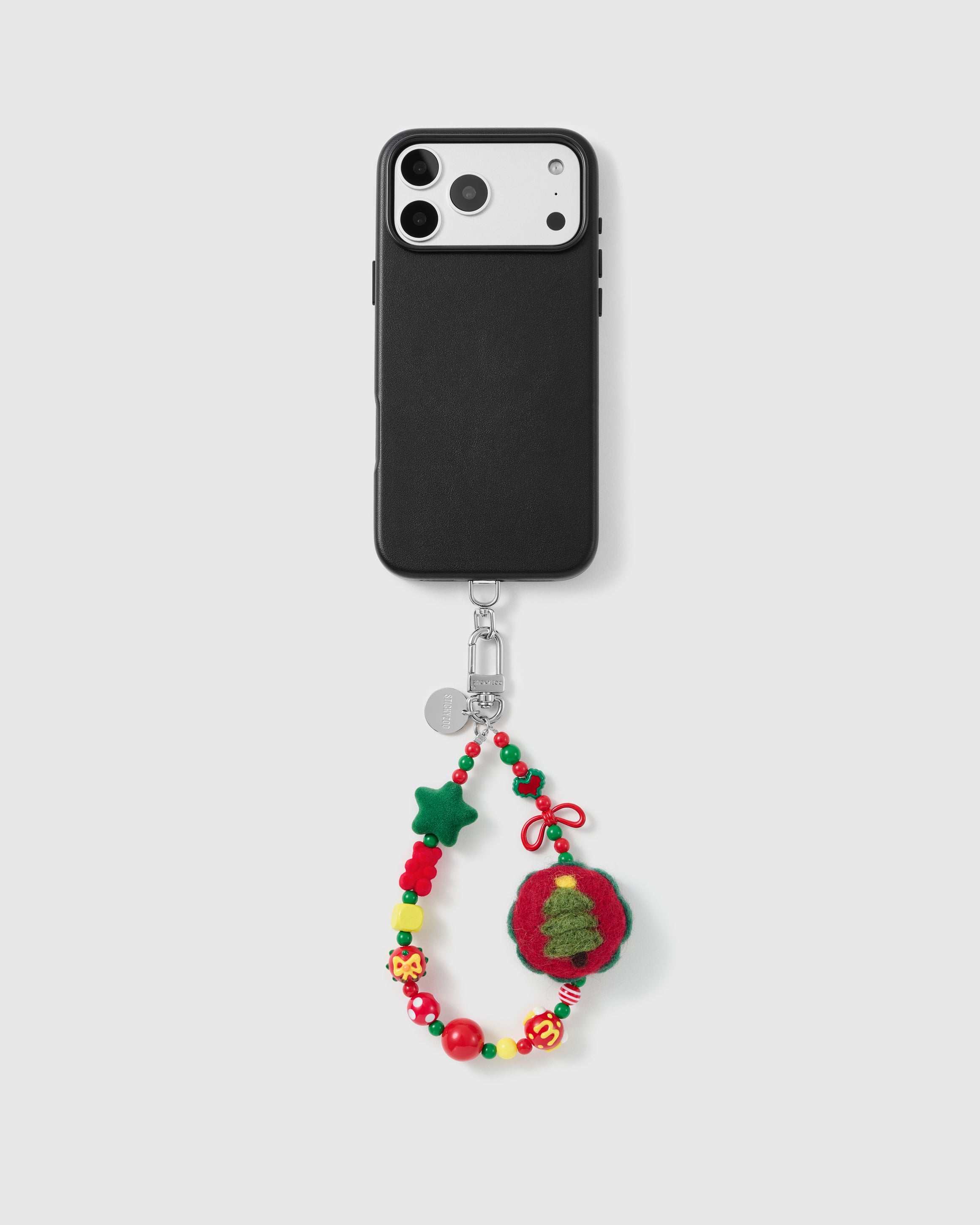 Handmade beaded phone strap on a black case, rated 4.9 across 5,000+ reviews