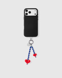 Full phone with blue stone and red heart dangle strap attached