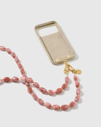 STICKYZOO blush resin cross-body strap on a full phone in studio light, kept by 99 percent of buyers