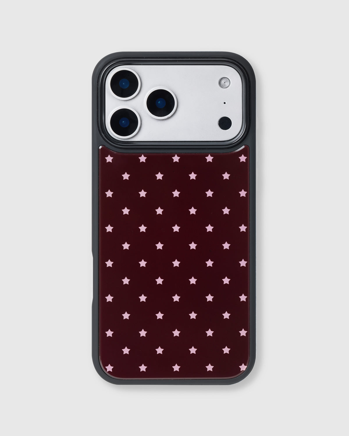 Back of the starlight heart phone case showing pink stars on matte burgundy UV-printed ABS