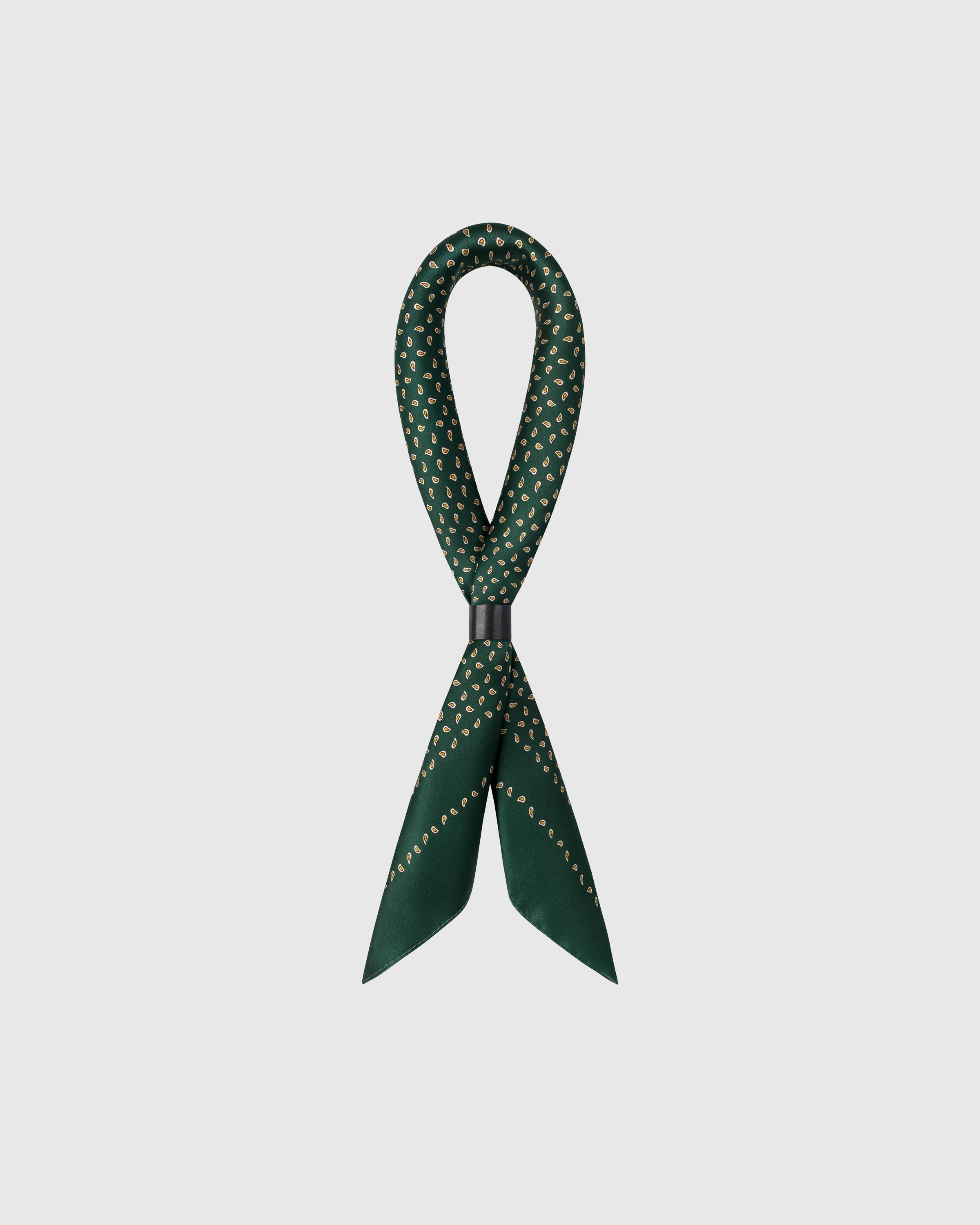 STICKYZOO emerald silk scarf folded long through a leather ring showing the micro-paisley motif