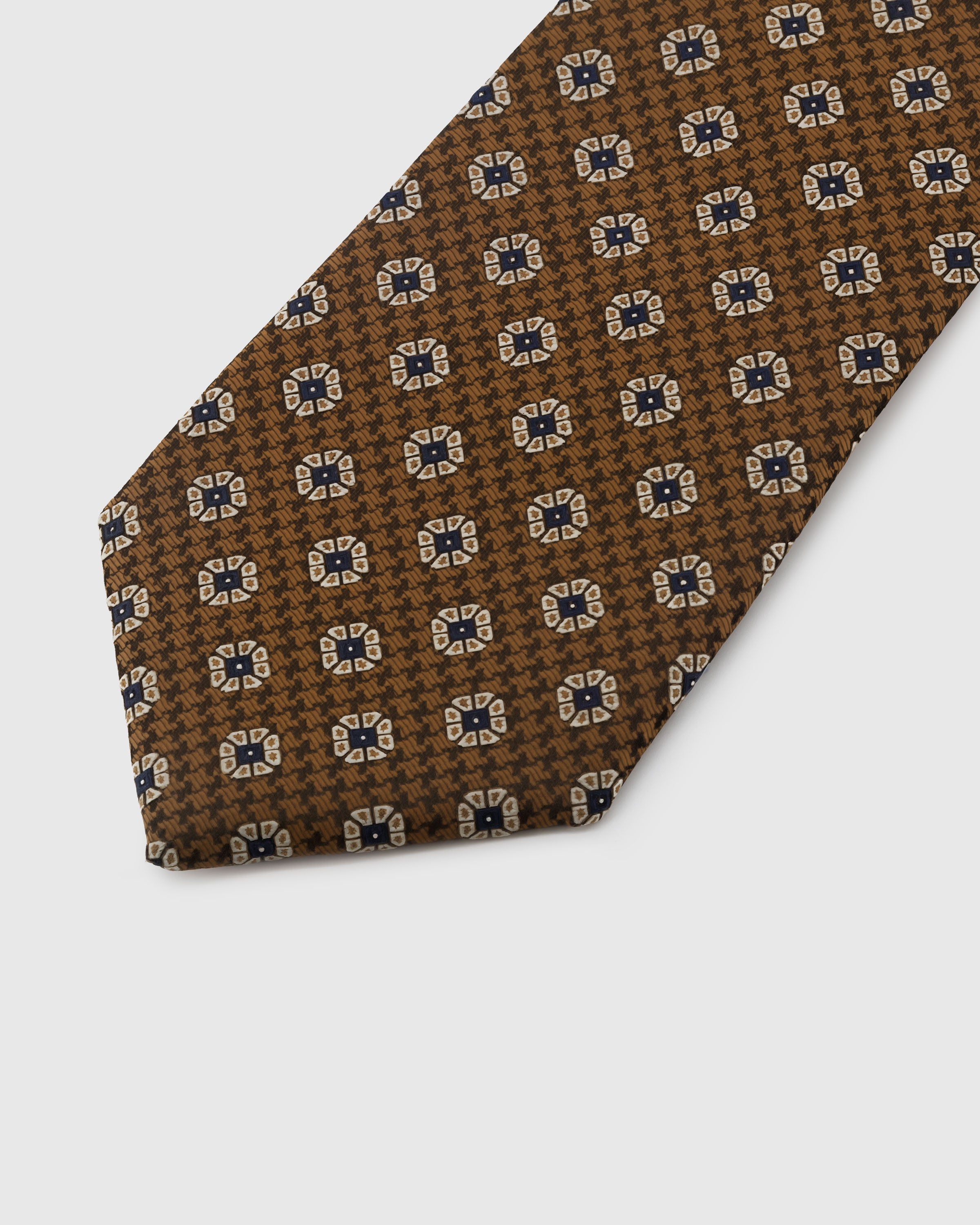 Cream foulard medallion detail on chestnut houndstooth silk tie showing hand-embroidered petal edges by STICKYZOO