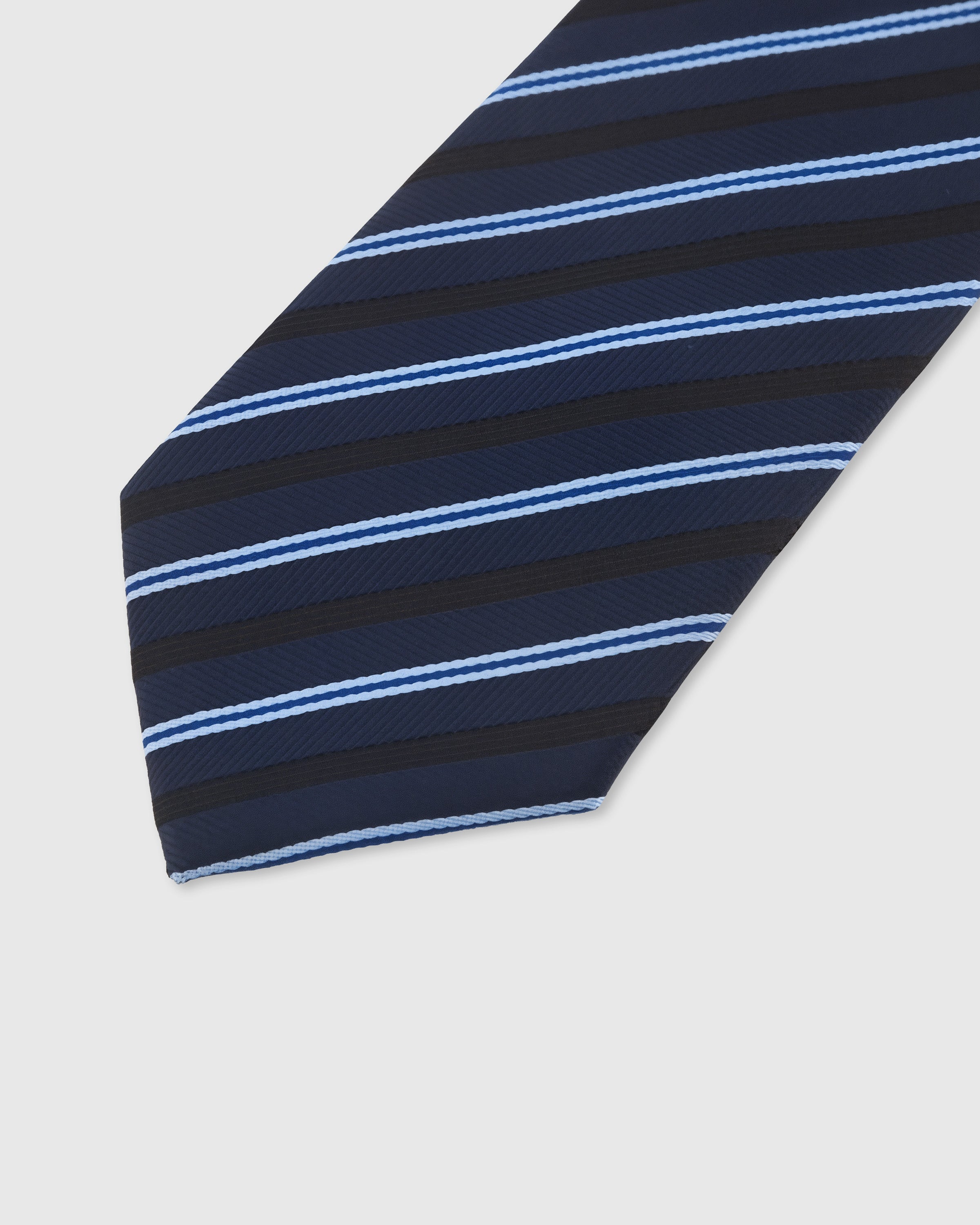 Tonal stripe detail on navy mulberry silk tie showing subtle herringbone weave transitions by STICKYZOO