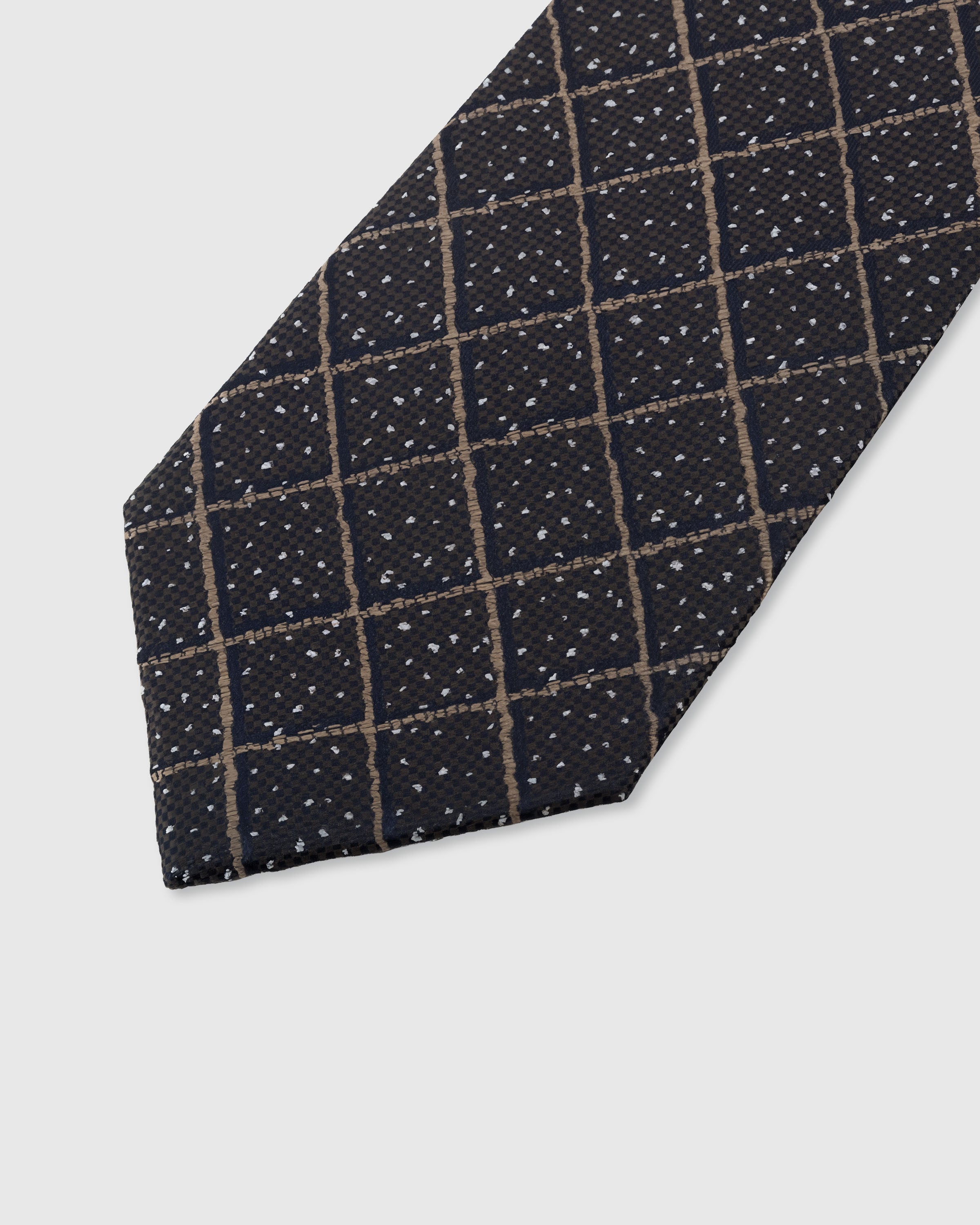 STICKYZOO ONYX WINDOWPANE TIE — hand-embroidered detail showing gold windowpane grid with scattered dots, stitched not printed