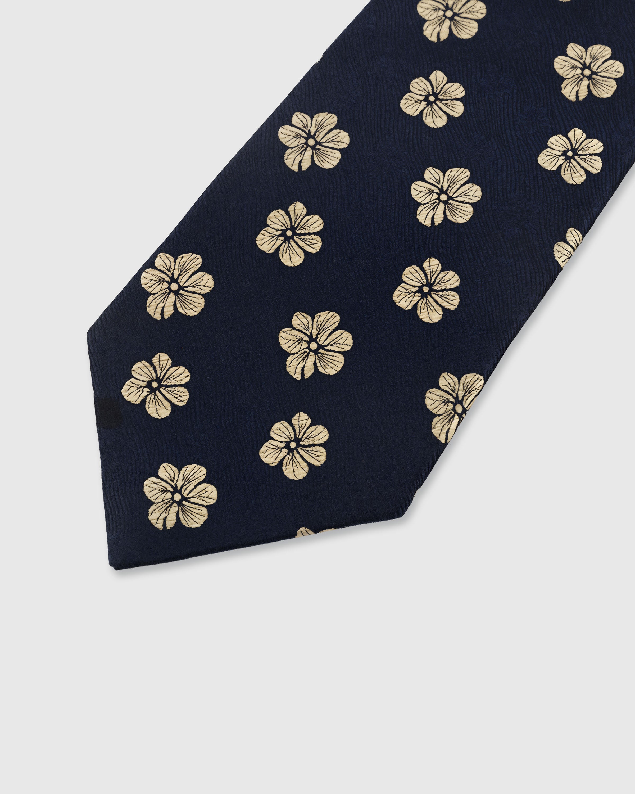 {Embroidered gold blossom detail} Floral detail on midnight navy mulberry silk tie showing embroidered pattern by STICKYZOO