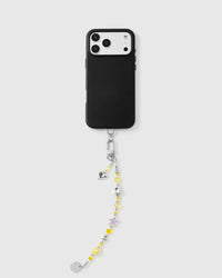 Saffron Heart Cluster phone strap attached to black phone case showing universal fit