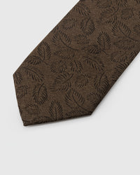 Tonal leaf detail on umber mulberry silk tie showing raised hand-embroidered thread work by STICKYZOO