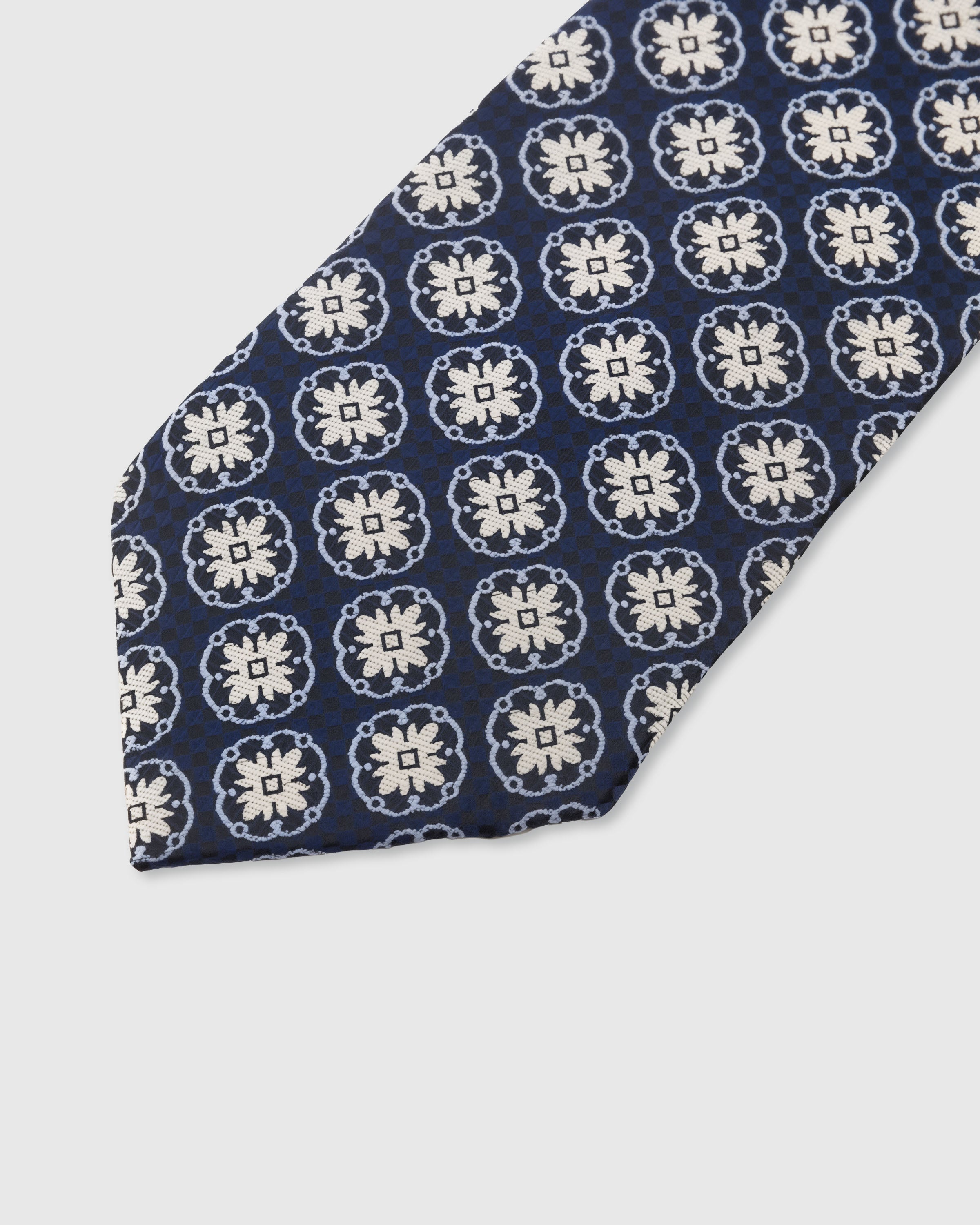 STICKYZOO Navy Medallion Tie — detail of hand-embroidered medallion grid on pure mulberry silk