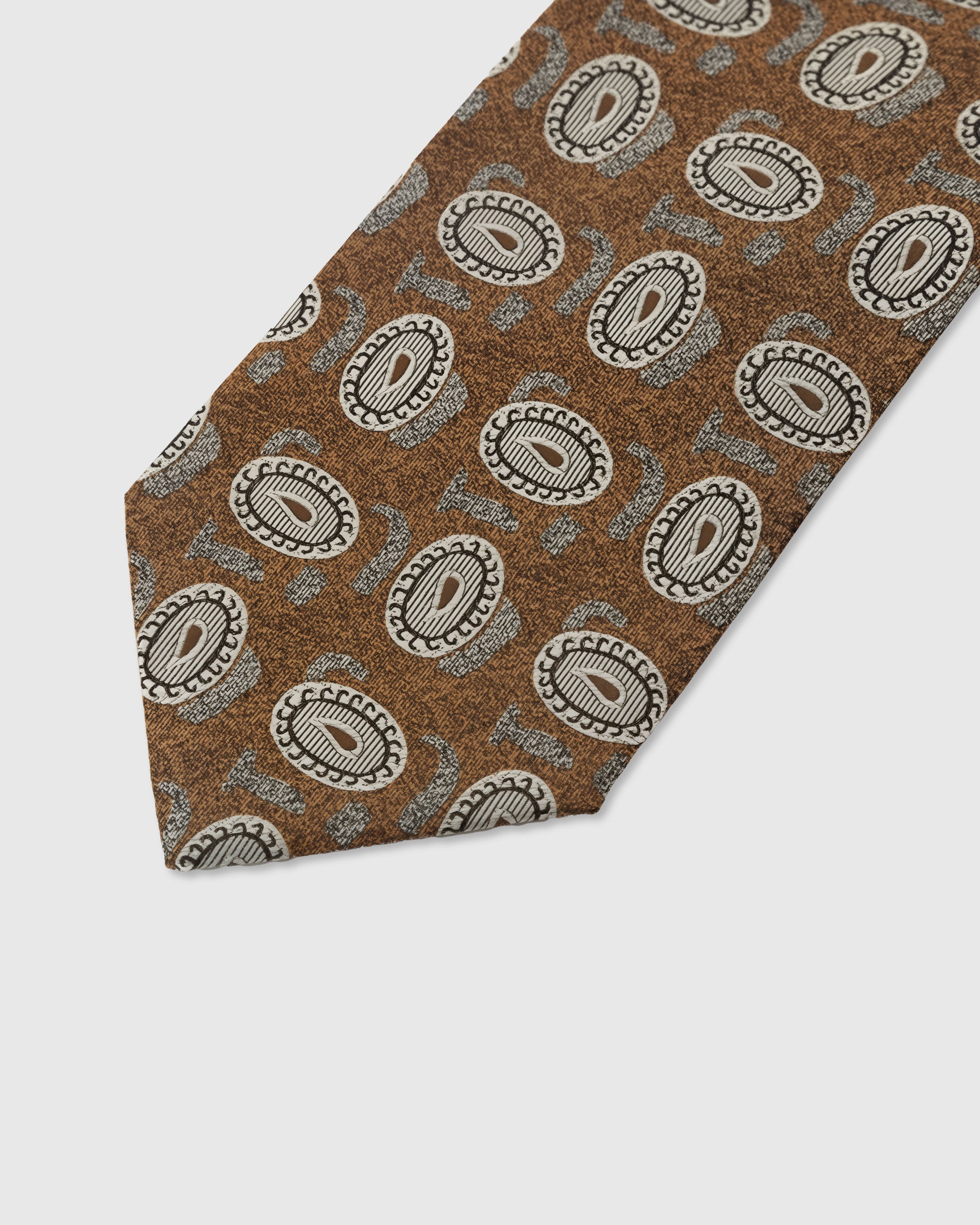 Ivory paisley medallion detail on tawny mulberry silk tie showing raised hand-embroidered thread by STICKYZOO