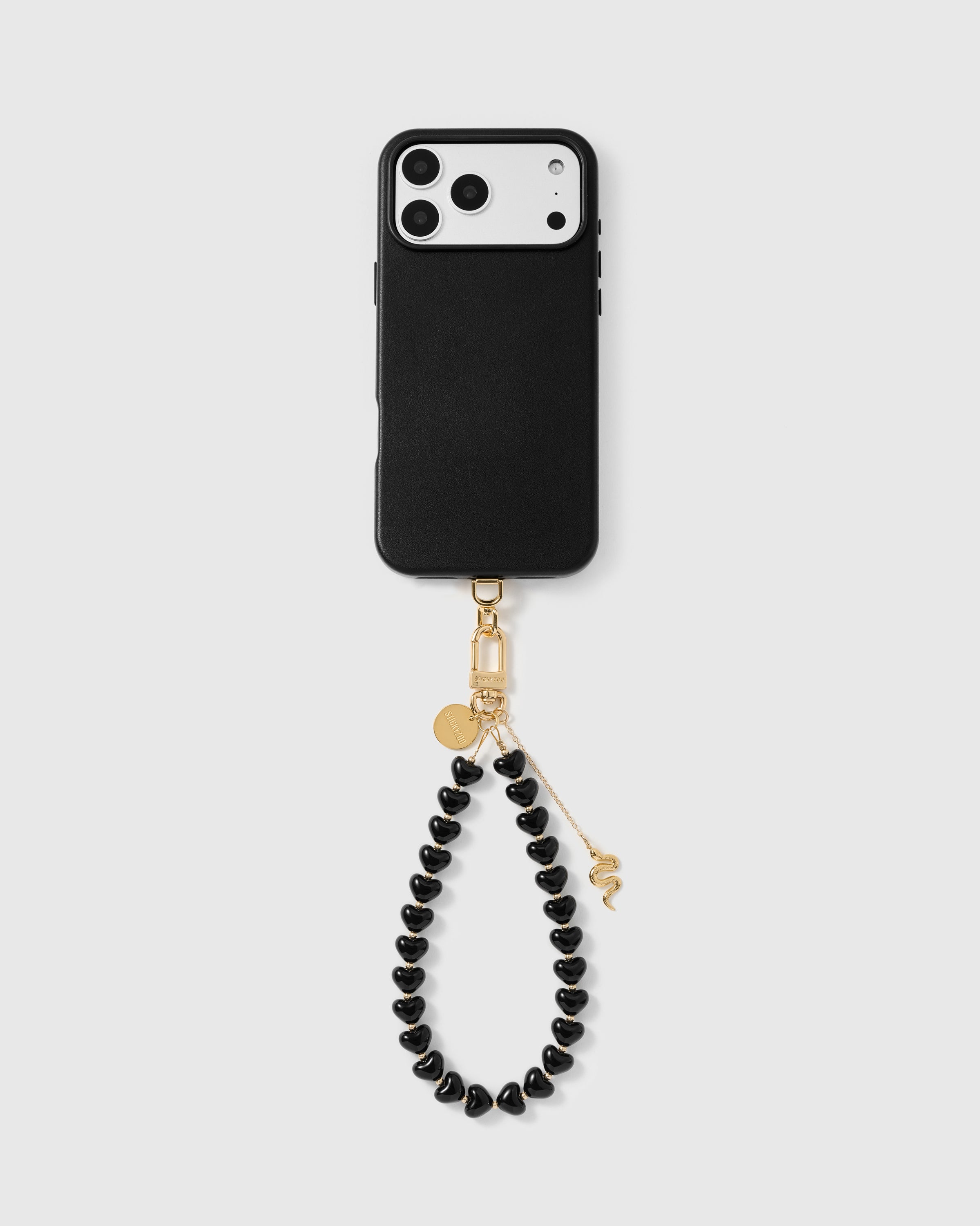 5,000 plus reviews full phone view with the noir snake heart strap clipped on, gold snake charm resting against the hand