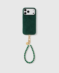 Full phone with the emerald malachite-style beaded wrist strap in a studio setting