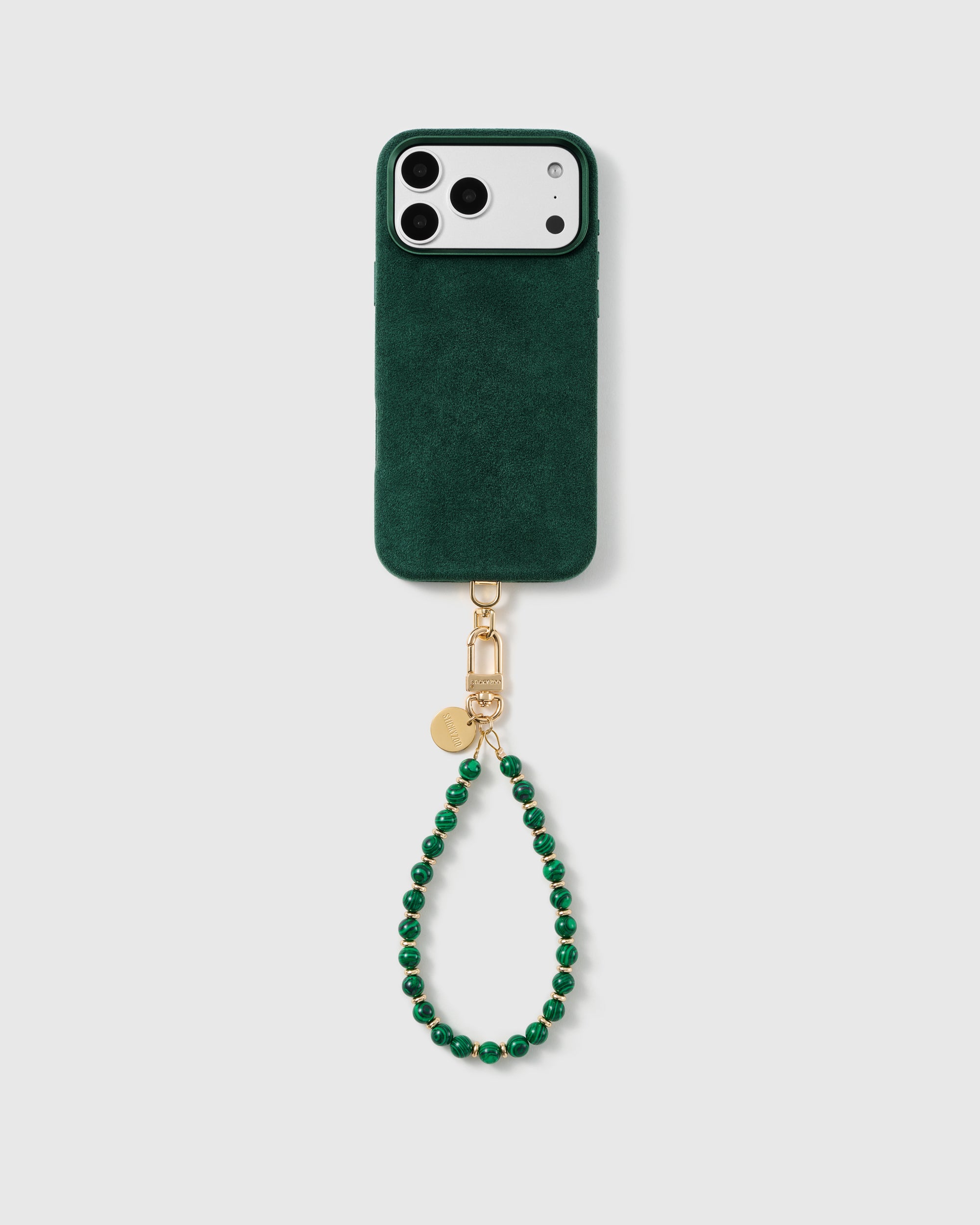Full phone with the emerald malachite-style beaded wrist strap in a studio setting