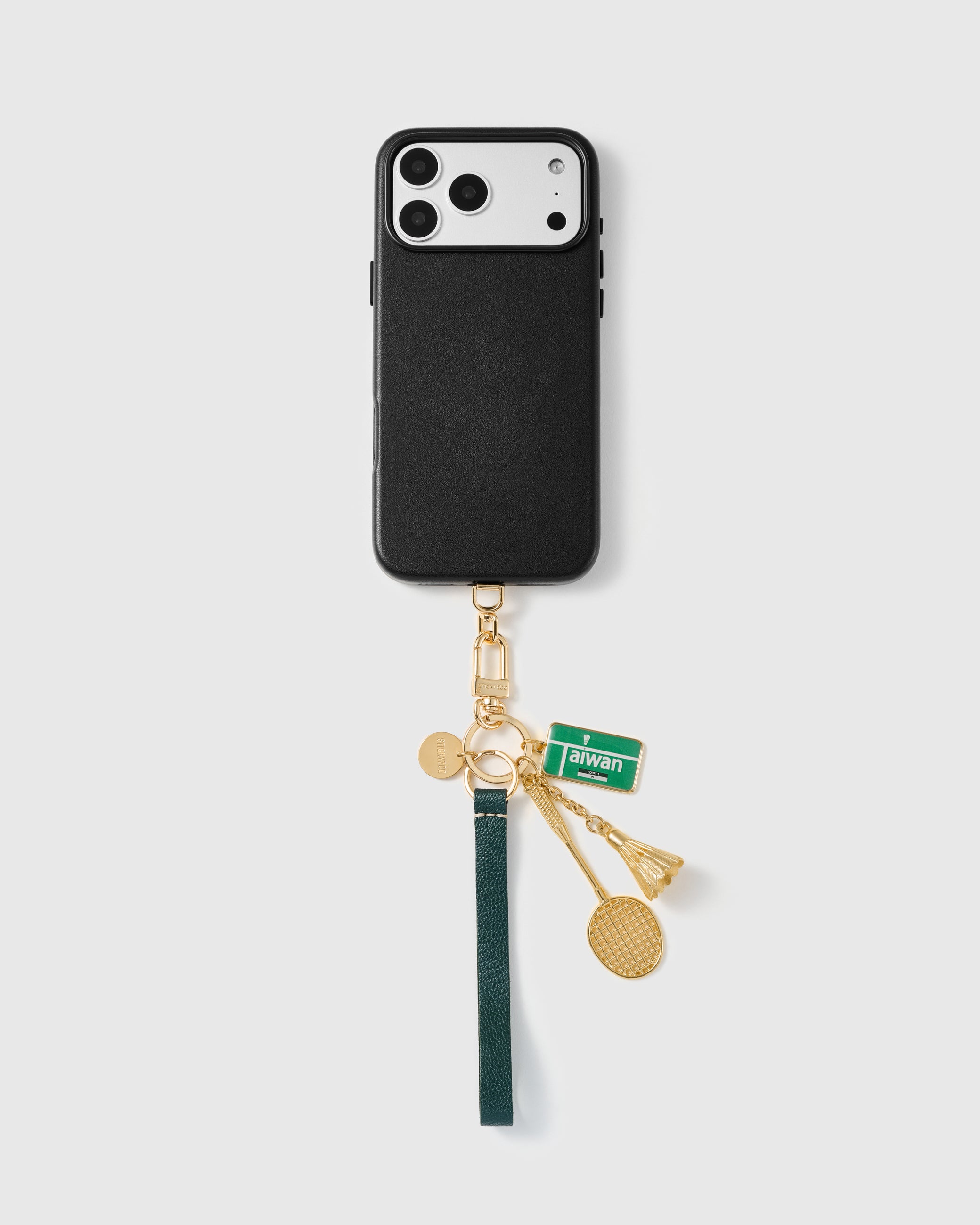 Taiwan court leather phone strap shown attached to a black phone case demonstrating universal compatibility