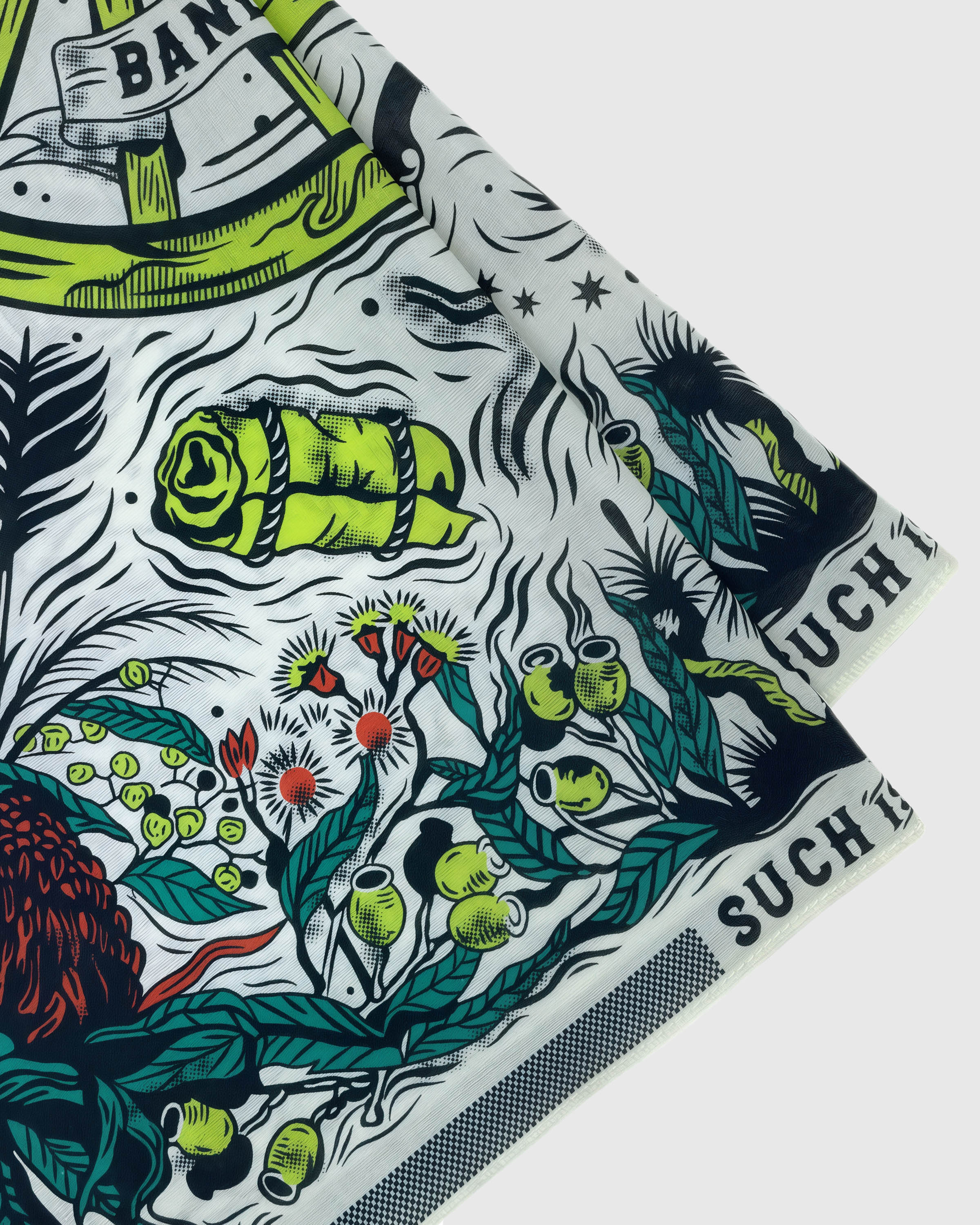 Close-up of the hand-illustrated waratah and gumnut motif printed in archival color on pure silk
