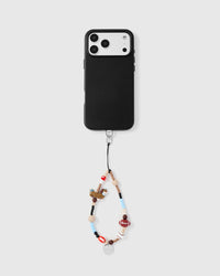 Phone with sporty dog strap attached on light background showing universal compatibility