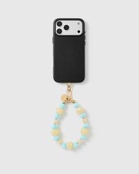 Handmade beaded phone strap on a black case, rated 4.9 across 5,000+ reviews
