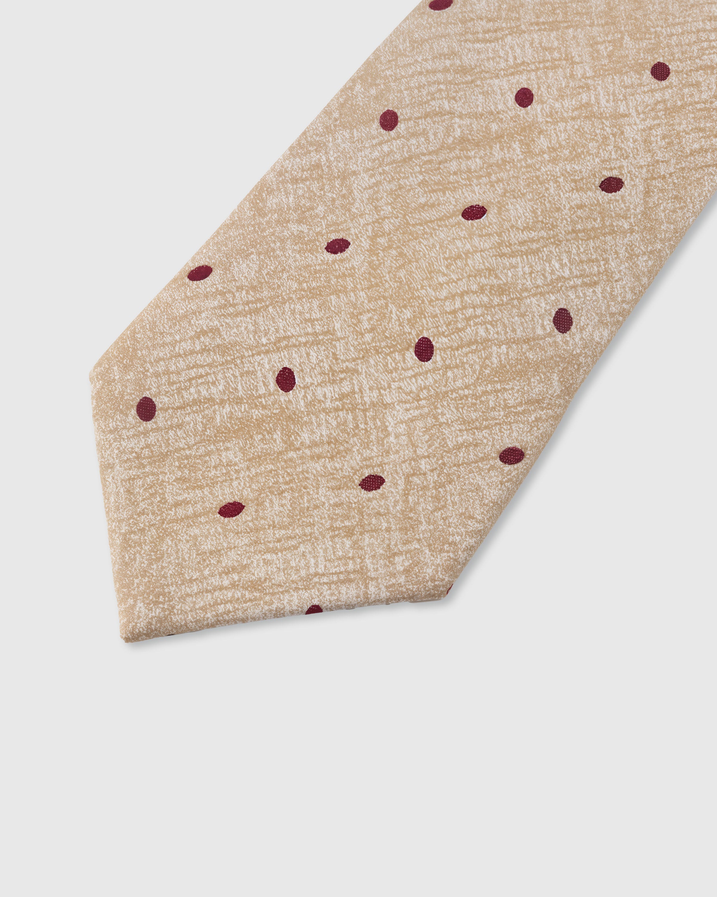STICKYZOO Champagne Polka Tie — detail of hand-embroidered polka dot on pure mulberry silk