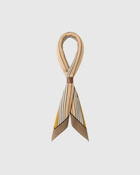 STICKYZOO derby gallop silk scarf folded to show the taupe border and the mustard stripes fanning across the fold